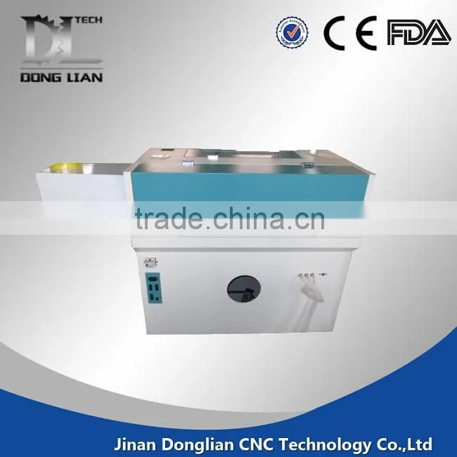 6040 small model alibaba hot sale jinan donglian used co2 laser cutting machine for pvc/glass