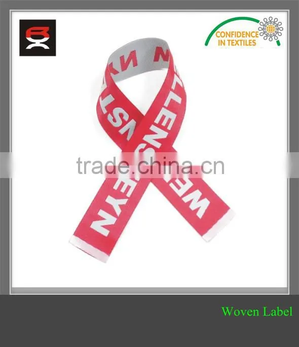 Brand name woven clothing label with center fold