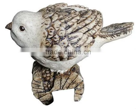 Bird standing on a base pot hanger outdoor birds sculpture