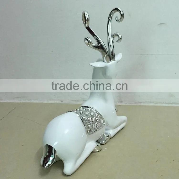 Polyresin sitting reindeer sculpture