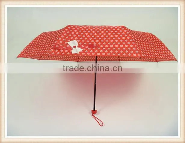 Red fold umbrella with white flower handle color match the fabric