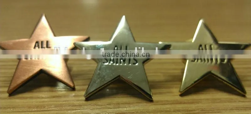 ALL SAINTS gold/silver/brass star shaped metal lapel pin badge