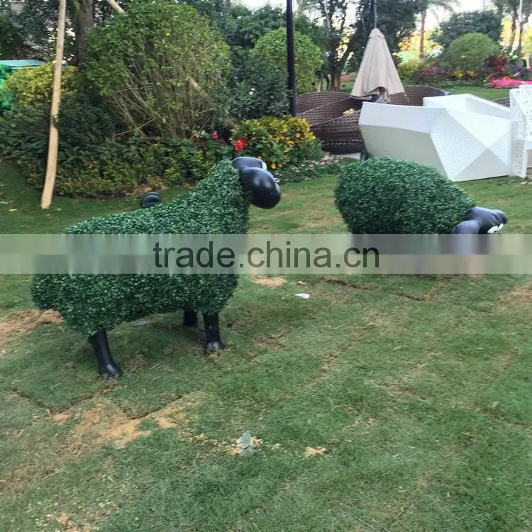 Fiberglass goat statue with artificial grass