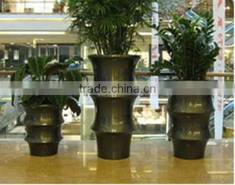 Golden fiberglass planter flowerpot
