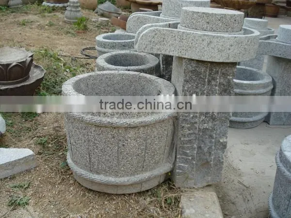 Antique millstone fountain