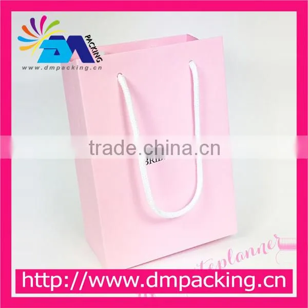 elegant pink clothing paper bag with handle for clothing shop