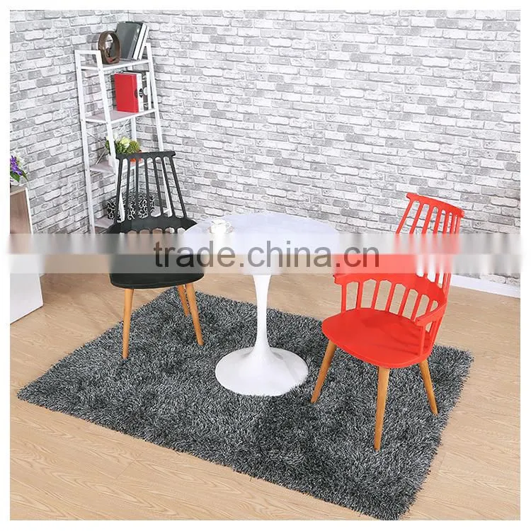 High quality red plastic chair with beechwood legs