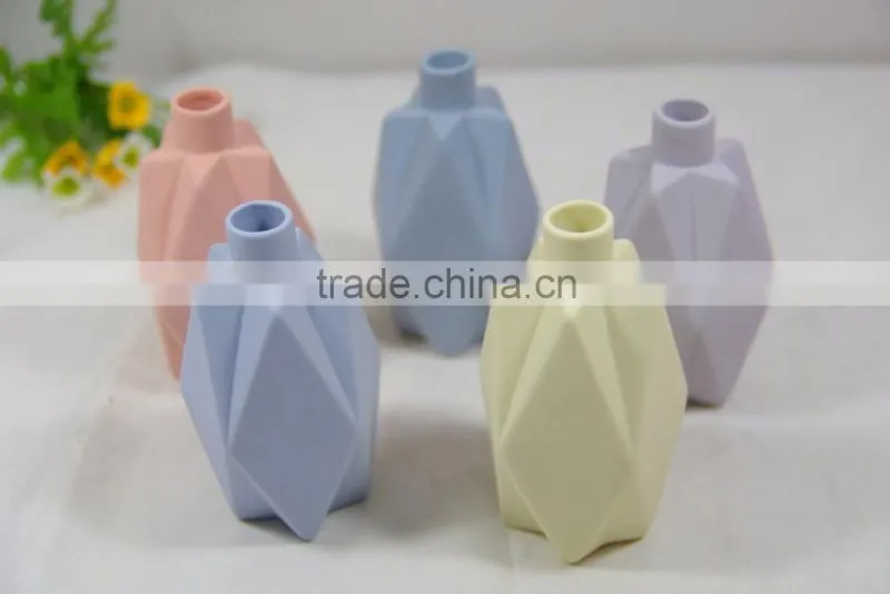 Small ceramic origami flower vase