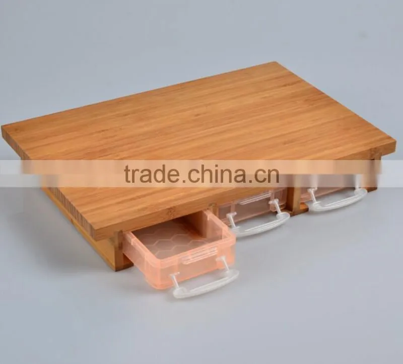 Bamboo cutting board with storage drawers