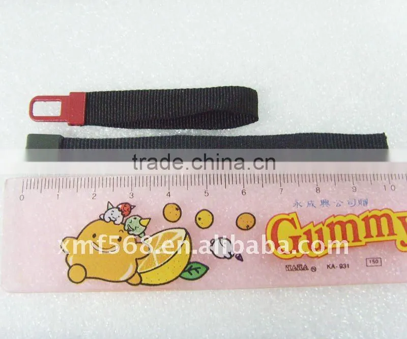 Plastic injection zipper pull with woven tape