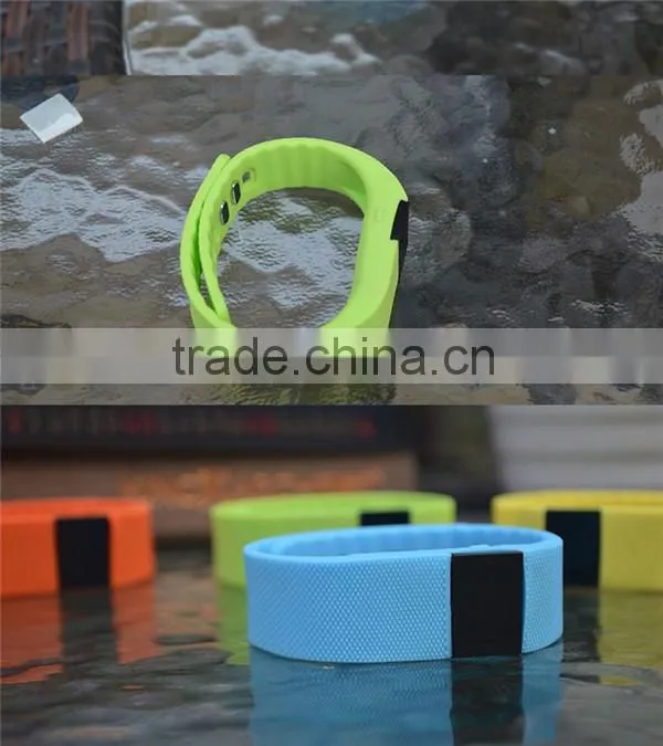 A button the TW64 smart bluetooth bracelet