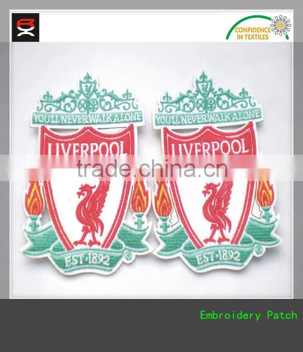 Adhesive pellon backing embroidered border woven patch