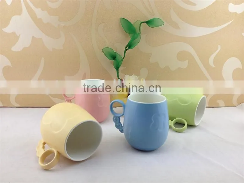 round handle embossed butterfly ceramic cup