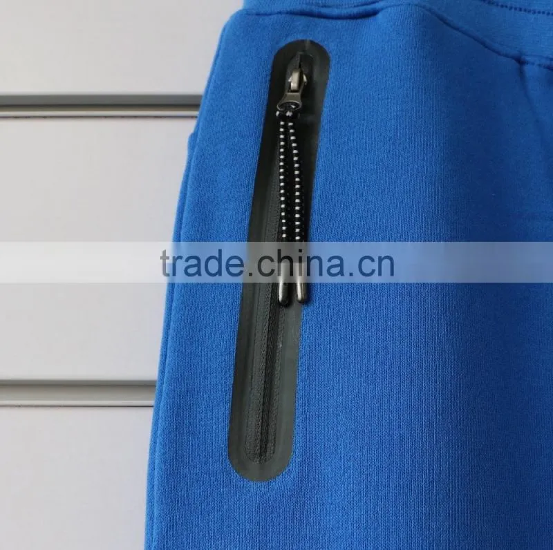 100% cotton men jogging pants with side waterproof pockets and logo print