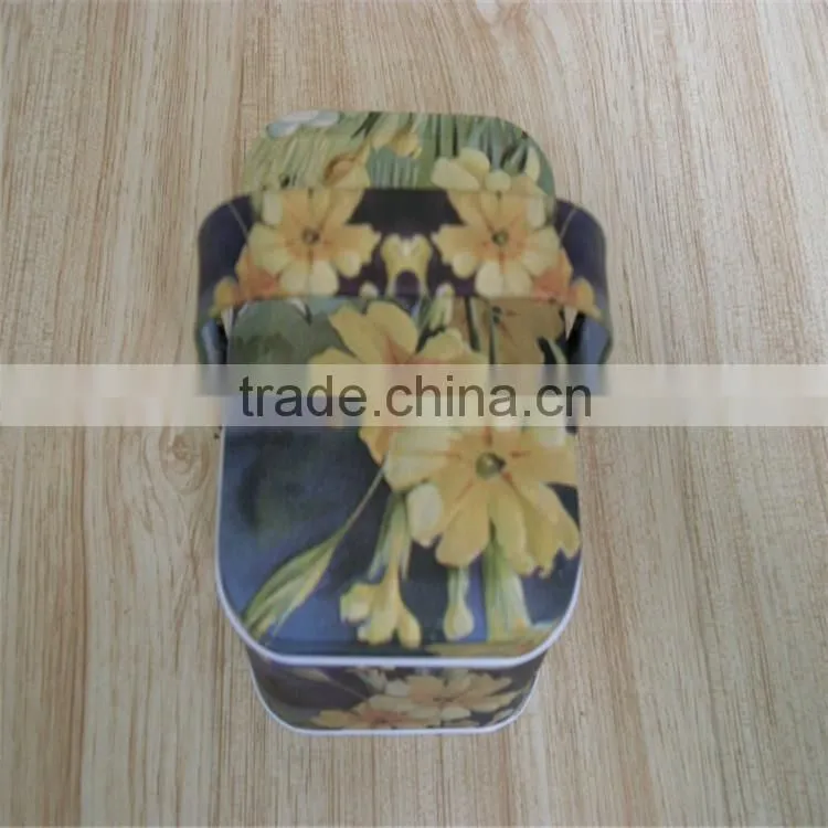unique shaped metal tea can with handle