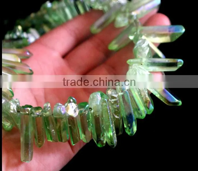 Green aura of titanium coating on quartz crystal necklace for healing