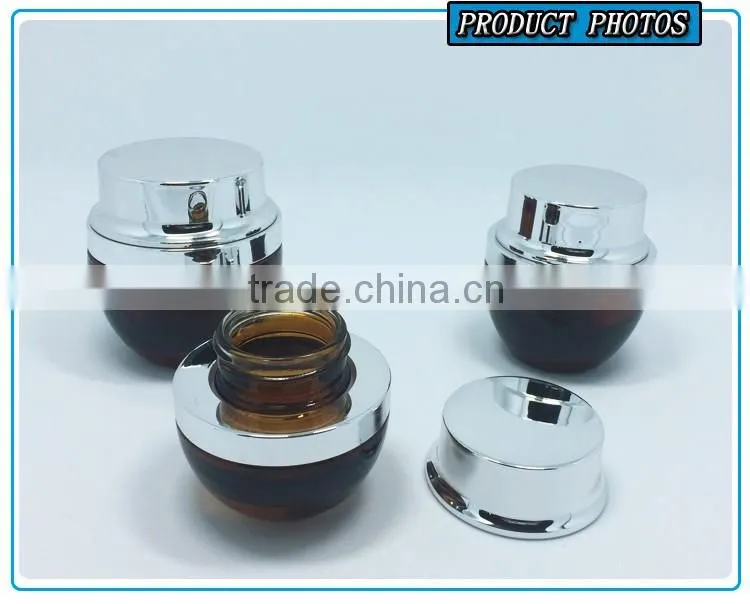 Amber coloured cosmetic glass lotion bottles with silver pump cap