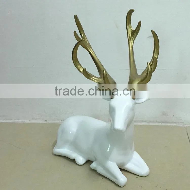 Resin sitting reindeer statue