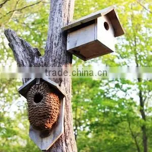 Rustic freestanding wooden bird cage outdoor