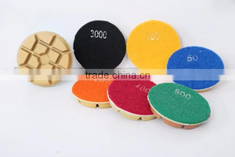 Abrasive concrete floor polishing pads