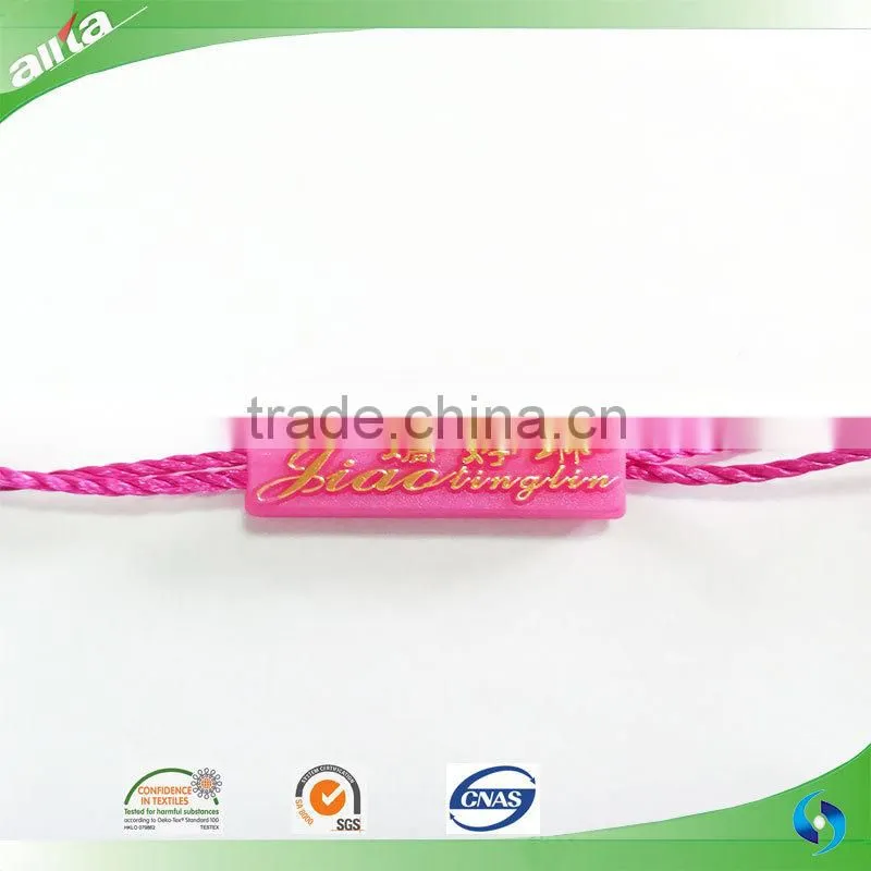 China Gold Supplier, customize gold color seal tag with letters embossed on light freshening green garment plastic hang tag