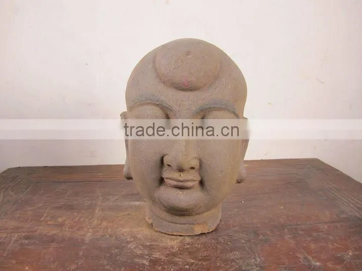 hand carved mud buddha head