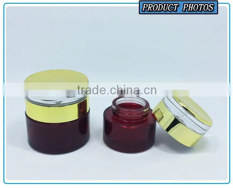Empty green colored glass cosmetic bottle and cosmetic glass cream jar