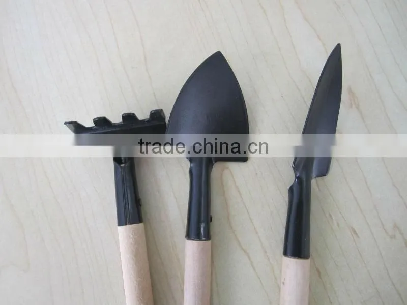 iron sapde with wooden handle garden tool wooden rake wooden shovel wooden spade