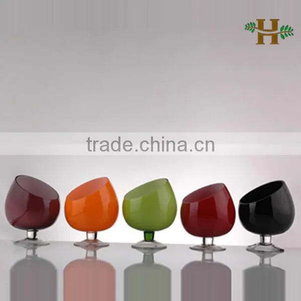 Handmade oblique opening colored glass candle holder on foot