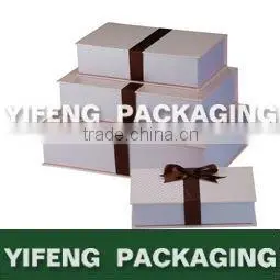 white nested cardboard boxes with ribbon design