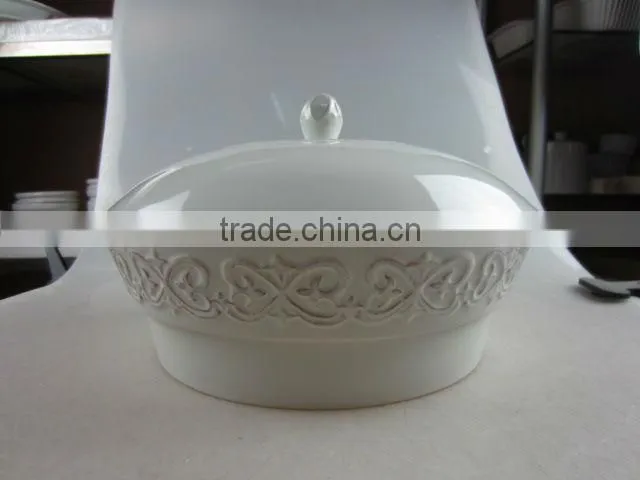 white ceramic round tureen with embossed design