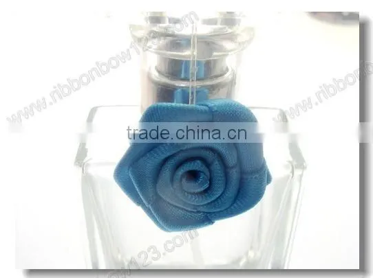 designs of ribbon flowers for perfume bottle