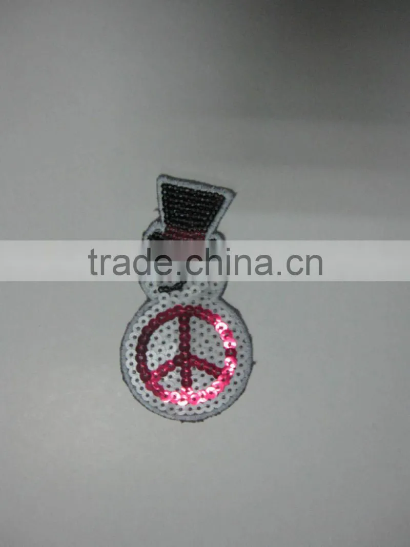 machine embroidered sequin badge design