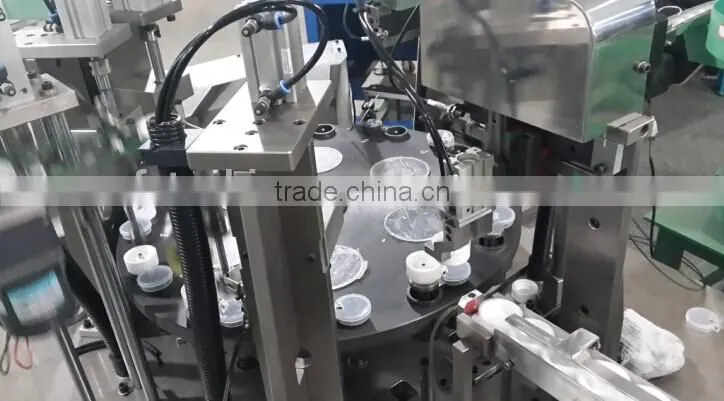 Automatic plastic cap assembly manufacturing machine
