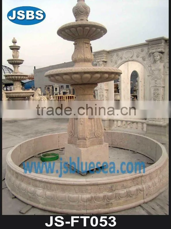 White marble wall fountain with angel