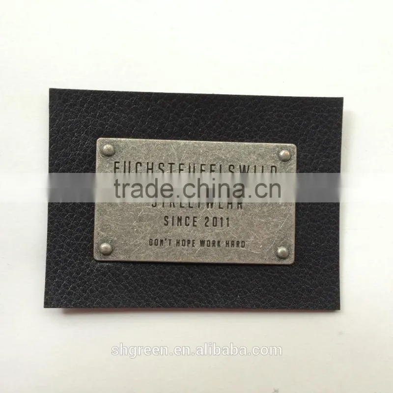 Promotional white real leather label with engraved logo metal plate