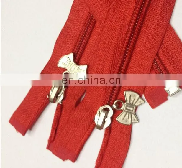 fashionable red nylon zipper design with metal bow puller