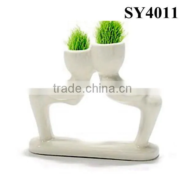 With grass hair white man growing grass doll