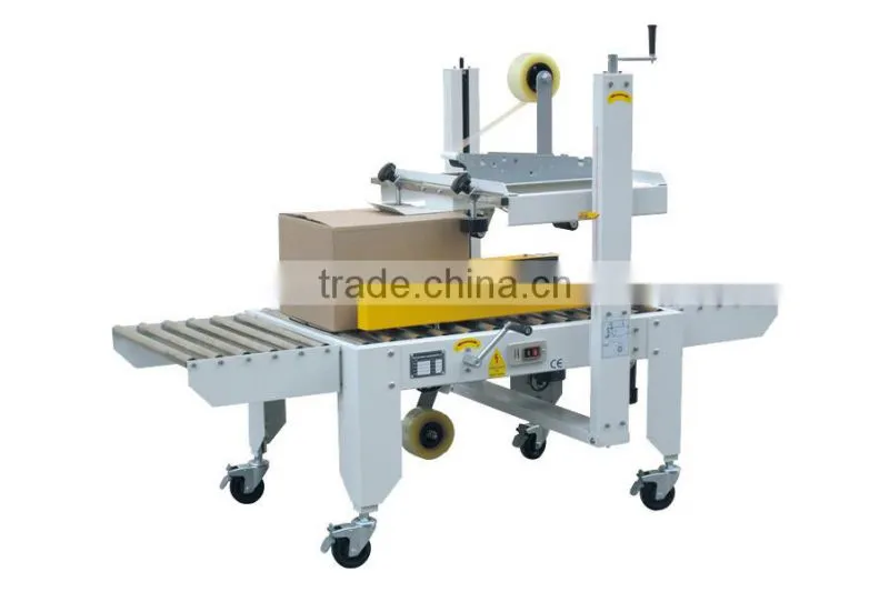Automatic side drive carton sealer