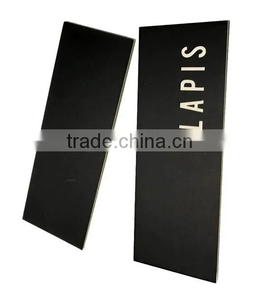 black hang tag with silver stamping
