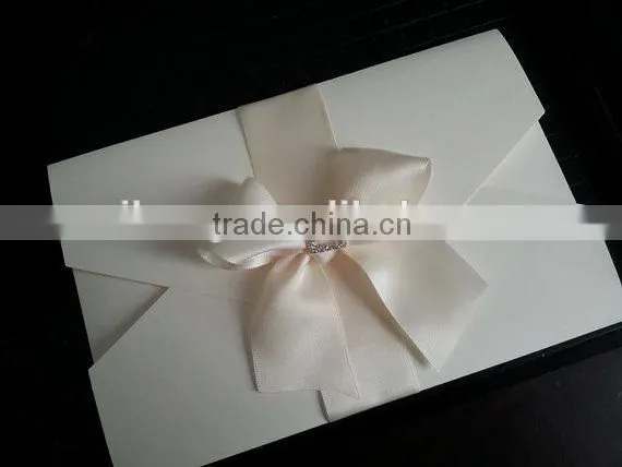 ivory double pocket fold ribbon and brooch wedding invitation card