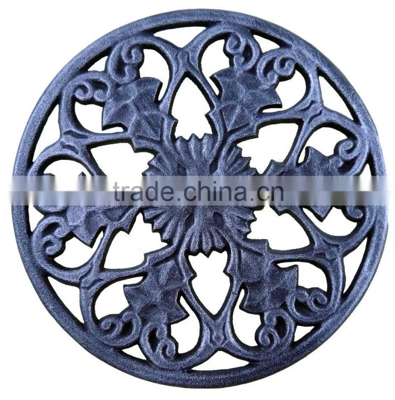 round antique cast iron trivets
