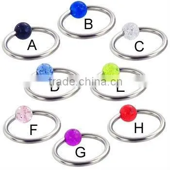 Captive bead ring with striped ball