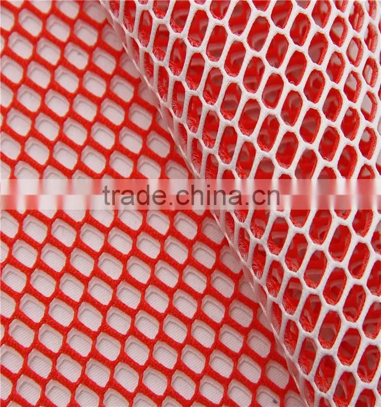 Cationic color low elastic macroporous mesh fabric