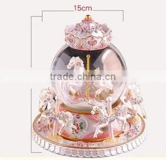 Exclusive resin carrousel rotate LED music snow globe