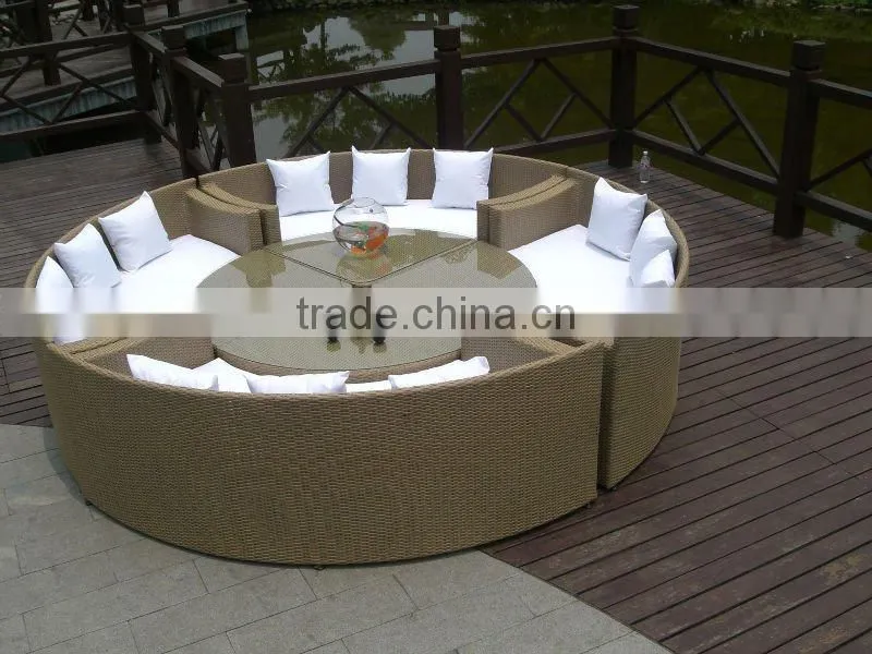 circle rattan glass top tables and sofas