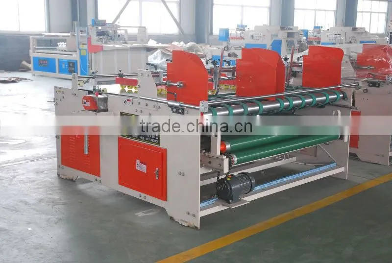 Corrugated paperboard folding gluing machine