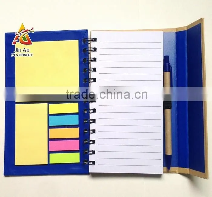 notebook with sticky notes and pen