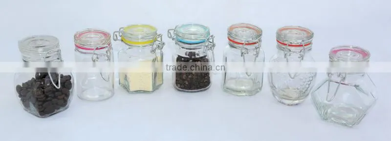 glass spice jar with colored ceramic folding top lid