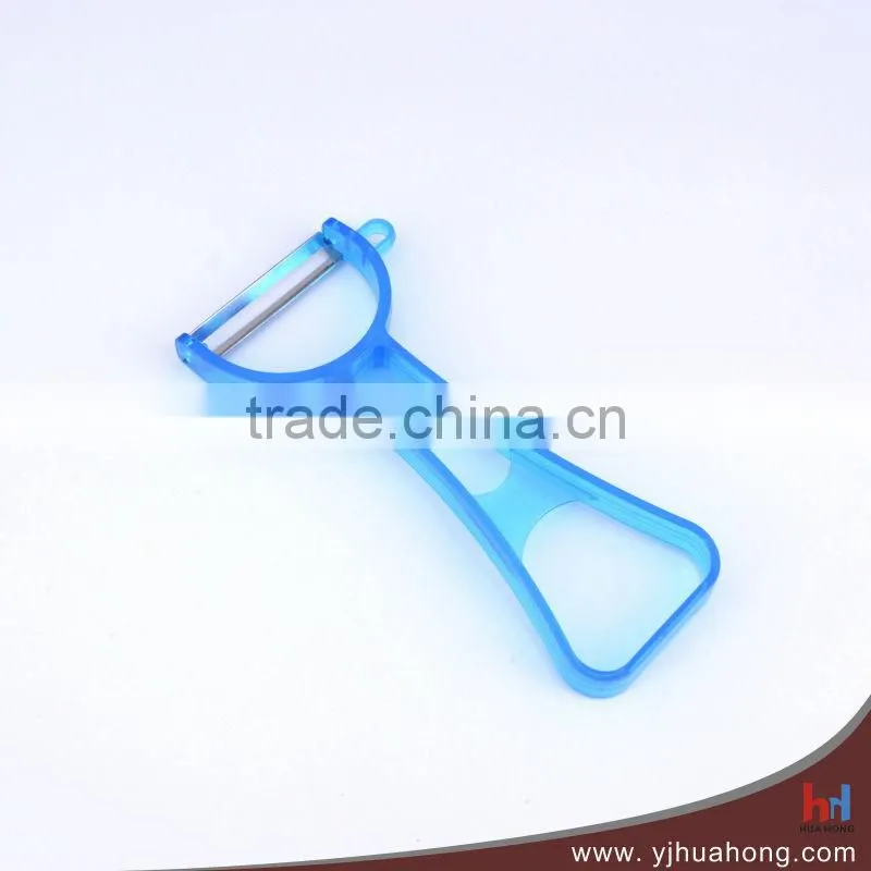 Wide blade manual vegetable peeler with transparent plastic handle